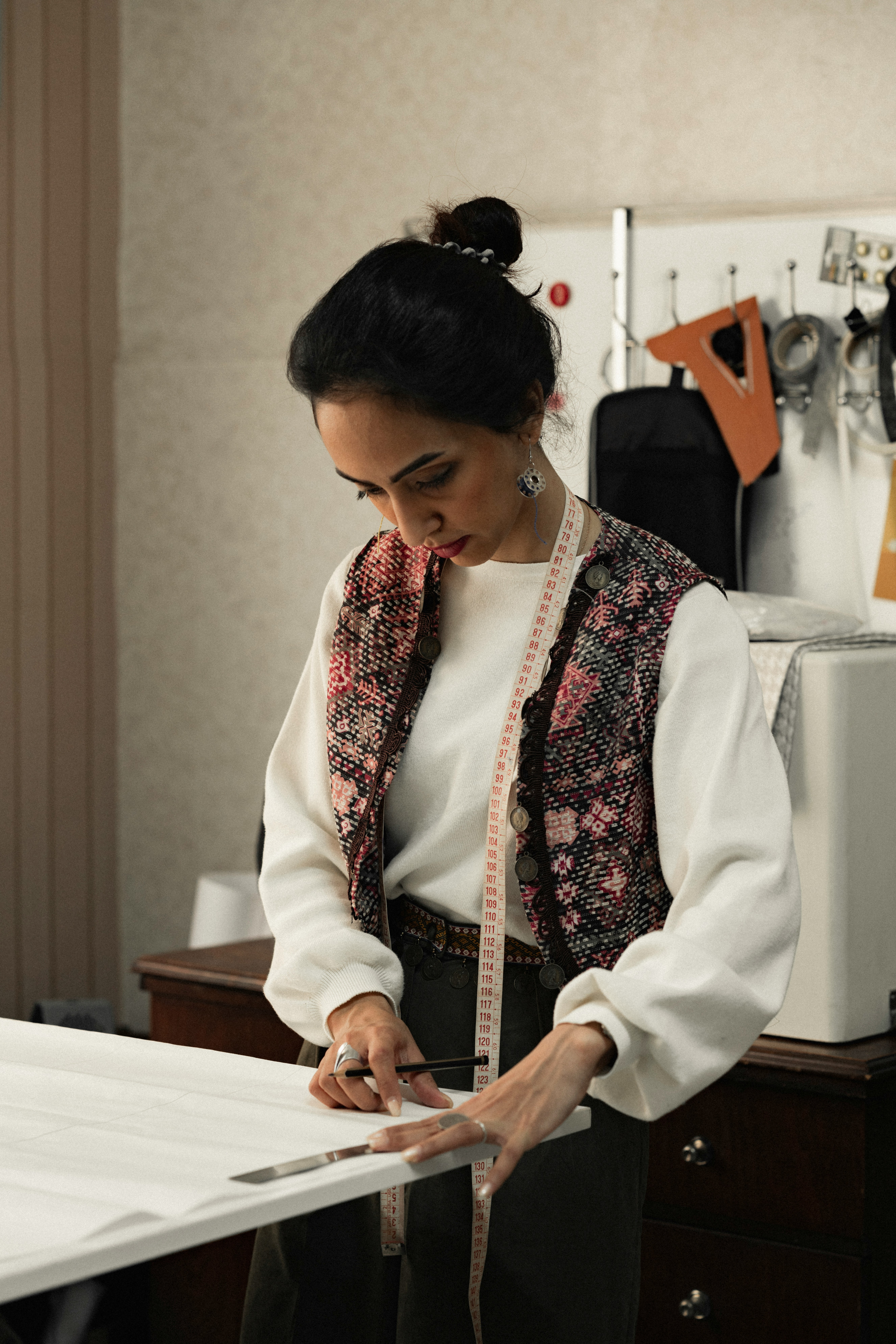 Designer working with fabric in a Bali atelier